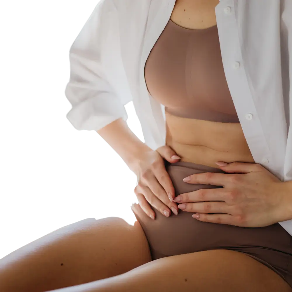 woman grabbing stomach in pain because of chronic inflammation